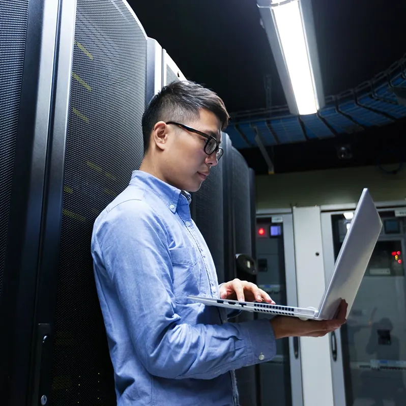 technician providing network device maintenance on laptop